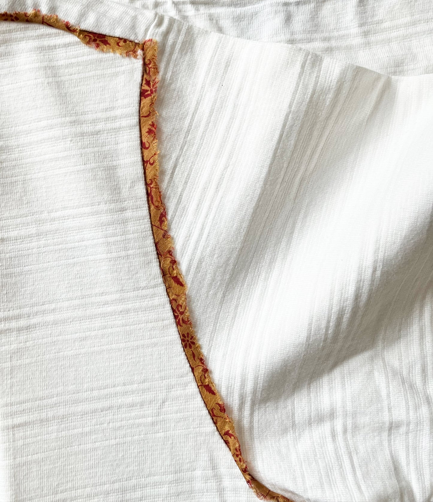 Ethically-produced Quinto T-Shirt, created with 95% organic cotton and 5% up-cycled saree from Mumbai - a unique expression of sustainable fashion.